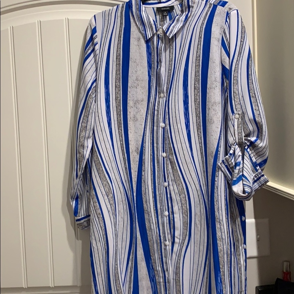 Never worn. Tabs on sleeve for longer or shorter.